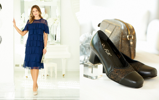 A woman in a blue dress wearing heel shoes