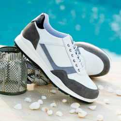 A pair of white, black and grey laced trainers